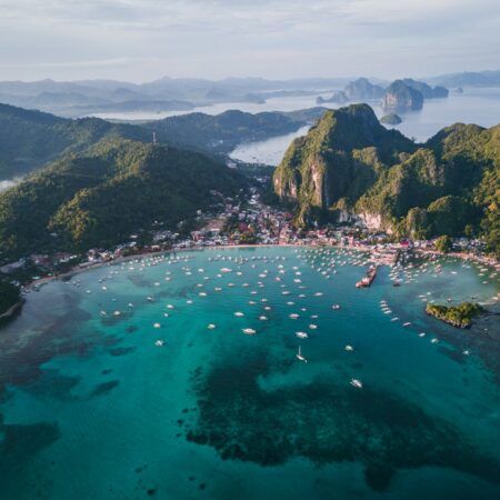 landscape photography of island with boats